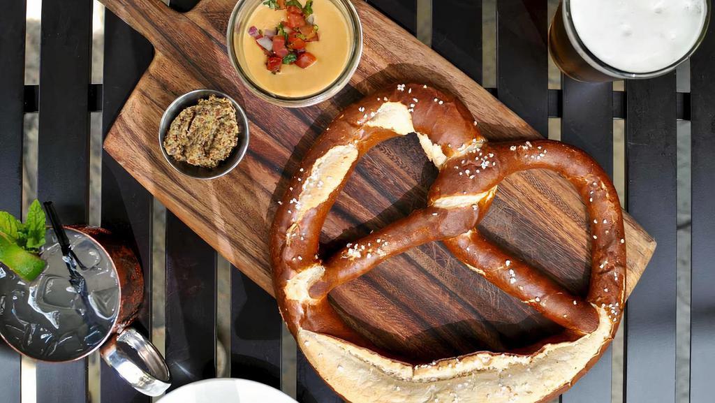 Big Soft Pretzel · Freakishly big bavarian pretzel with cheese sauce  for dipping.