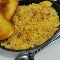 Guinness Mac And Cheese · Medium shells tossed in our Guinness cheddar mac sauce. Topped with breadcrumbs and baked go...