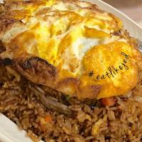 Nasi Goreng · Indonesian fried rice with shrimp, beef, chicken and fried eggs.