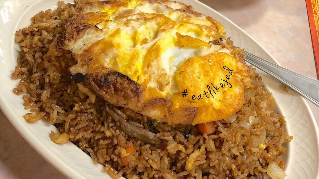Nasi Goreng · Indonesian fried rice with shrimp, beef, chicken and fried eggs.
