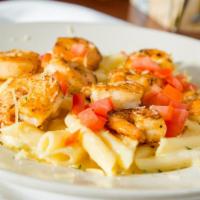 Cajun Shrimp Alfredo · Sautéed shrimp over penne pasta tossed in our housemade alfredo sauce and topped with tomato...