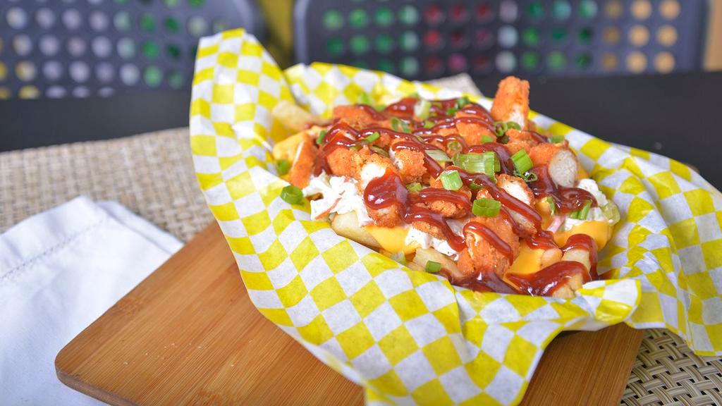 Sal'S Fries (Small) · Nacho cheese, coleslaw, chicken strips, and green onions.