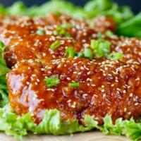 Chicken Tender · Dipped with Eather  buffalo, BBQ, or mango habanero.   Garnished with  green onions and  Ses...