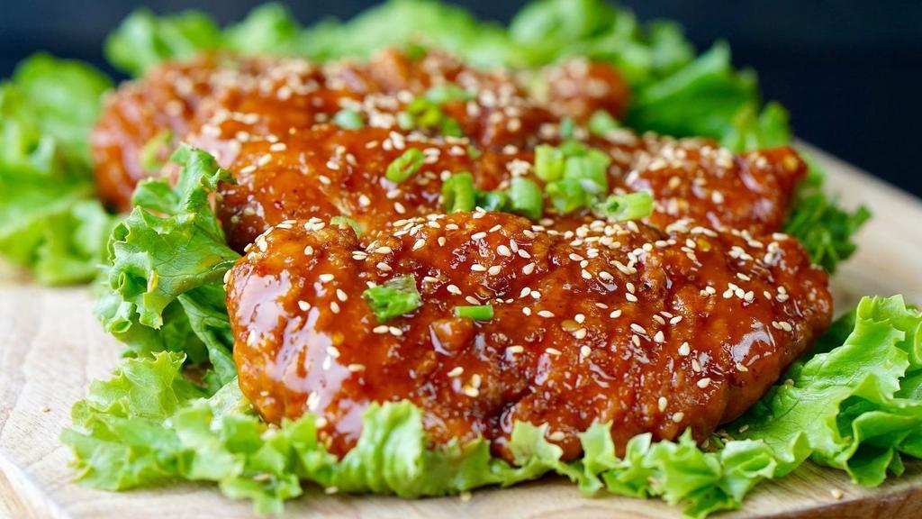 Chicken Tender · Dipped with Eather  buffalo, BBQ, or mango habanero.   Garnished with  green onions and  Sesame seeds