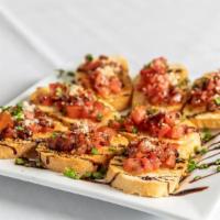 Bruschetta · Vine ripe tomatoes, basil and garlic served in toasted baguettes.