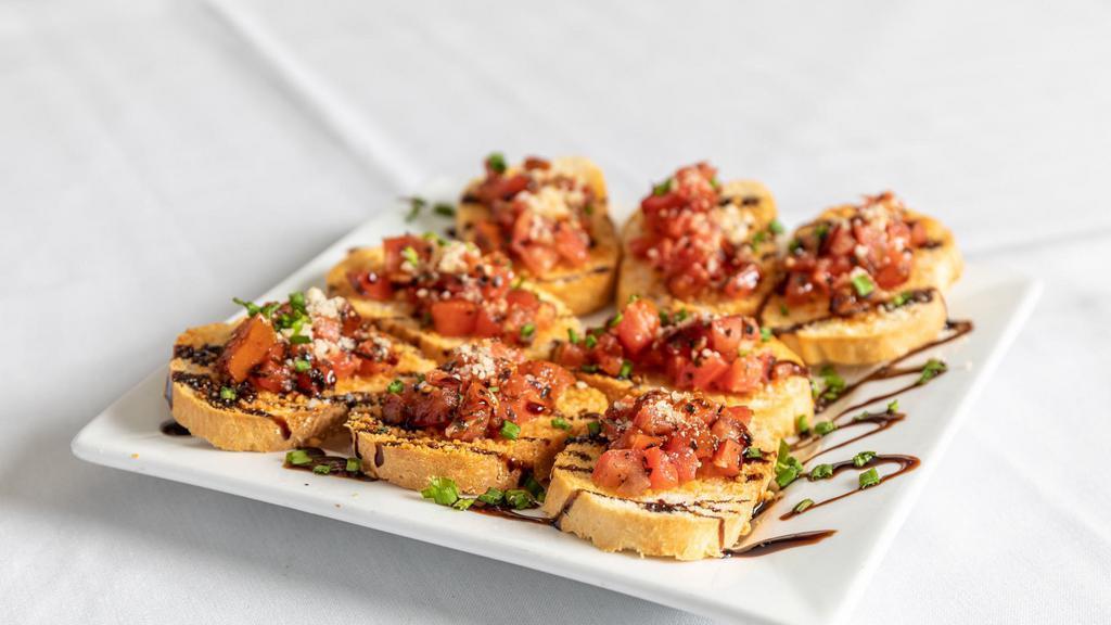 Bruschetta · Vine ripe tomatoes, basil and garlic served in toasted baguettes.