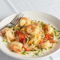 Shrimp Scampi · Jumbo shrimp sautéed with onions in a delicious garlic lemon butter wine sauce and tossed wi...