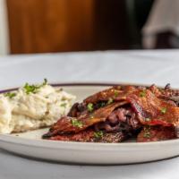 Liver With Bacon And Onions · Selected calves liver seasoned and sautéed, finished with sherry.
