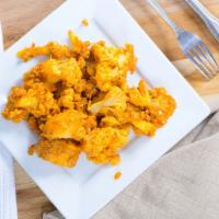 Aloo Ghobi · Fresh cauliflower and potatoes ccoked dry to perfection in mild spice with tomatoes, herb an...