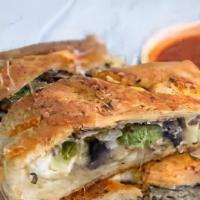 Steak Calzone · Grilled steak , mushrooms, onions, green peppers, mozzarella cheese, lettuce, tomatoes, mayo...