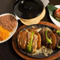 Fajitas · Sauteed onions and peppers served with rice and beans, guacamole y pico de gallo and tortill...