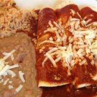 Enchilada Dinner · Our enchiladas are made on flour tortillas (corn available upon request). Then we stuff them...