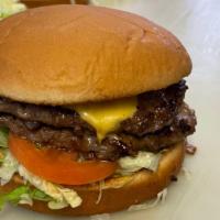 Double · Two patties, comes standard with mustard, lettuce, tomato, pickles, fried onion, and raw oni...