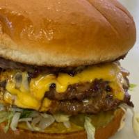 Triple · Three patties, comes standard with mustard, lettuce, tomato, pickles, fried onion, and raw o...