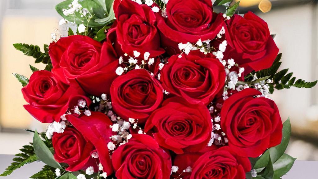 Gloria (Wr)-10007 · Beautiful One Dozen Red Roses with the Snow flower Wrap Bouquet.