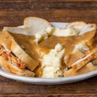 Turkey Manhattan · Hand-carved oven-roasted turkey breast sandwich topped with a large portion of mashed potato...