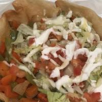 Taco Salad · Choice of rice, beans, lettuce, tomato, sour cream, cheese and guacamole.
