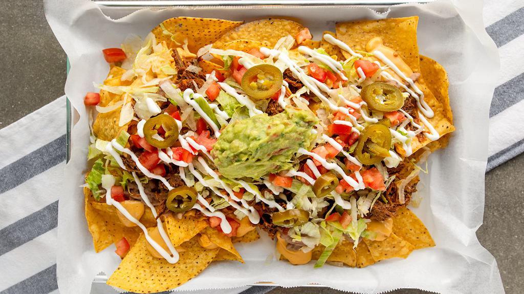 Jefa Nachos · Nachos include: choice of meat, beans, cheese, lettuce, tomato, sour cream, guacamole,
and jalapeños.