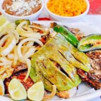 Pollo Al Carbon · Charbroiled chicken with side of rice,beans,salsas,tortillas,grilled cactus,peppers and onions