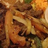 Bistec Ala Mexicana · Steak grilled with onions and jalapeños 
Side of rice and beans
