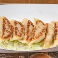 Gyoza (Popular Item) · Japanese-style dumplings filled with ground pork, cabbage and chives served with our homemad...