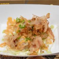 Tako Yaki · Wheat flour base batter filed with octopus, bonito flakes, green onion then deep-fried and d...
