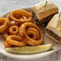 Philly Cheese · Sliced sirloin with Swiss cheese, green peppers & onions on hoagie roll. Add mushrooms for a...