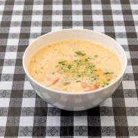 Tom Kha Soup · Spicy. Large bowl. Savory broth of coconut milk, spiced with mushrooms, cabbage lemongrass, ...