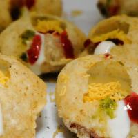 Chowpatty Puri · Hollow puri stuffed with potato-chhana masala, sweet and spicy chutney, yogurt and topped wi...