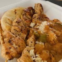 Chicken Kebob · Marinated chicken skewers on pita bread, diced tomatoes, onions, rice pilaf.