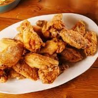 Fried Jumbo Chicken Wing Dings · 6 pieces served with lemon pepper and your choice of regular or garlic parmesan fries.