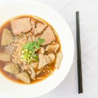 Thai Beef Noodle Soup (Pho) · Flavorful beef broth with sliced beef, beef stew, beef meatball, and rice noodle topped with...