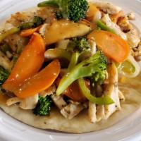 Aegean Chicken On Pita · Marinated chicken breast chopped and grilled w/ broccoli, carrots, peppers, onions, &
honey ...