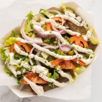 Gyro · Lamb and beef, ground together, sliced thin then piled high on Pita bread with lettuce, toma...
