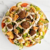 Falafel Salad · Vegetarian Dish. A delicious blend of lettuce, onion, cucumber, tomato, chickpeas, fried pit...