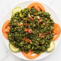 Tabouli Salad · Vegetarian Dish. Minced parsley, chopped tomatoes, green onion, and crushed wheat (bulgar) t...