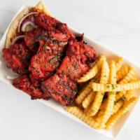 Spicy Musabab Chicken Plate · Takes 15 minutes or more to be done.  Spicy Pita bread topped with spicy grilled chicken thi...