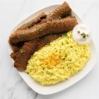 Gyro Plate · Gyro meat served with side salad, one garlic sauce and your choice one option of yellow rice...
