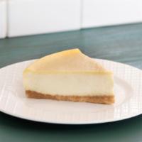 Vanilla Bean Cheesecake Slice · Creamy and dense handmade vanilla cheesecake on top of a butter graham cracker crust. Option...