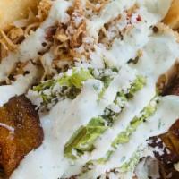 Arepa Supreme · Arepa chips, shredded beef, shredded chicken, black beans, sweet fried plantains, mashed avo...