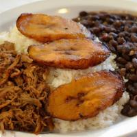 Pabellon Criollo · White Rice, black beans, sweet fried plantains and sheredded seasoned beef.