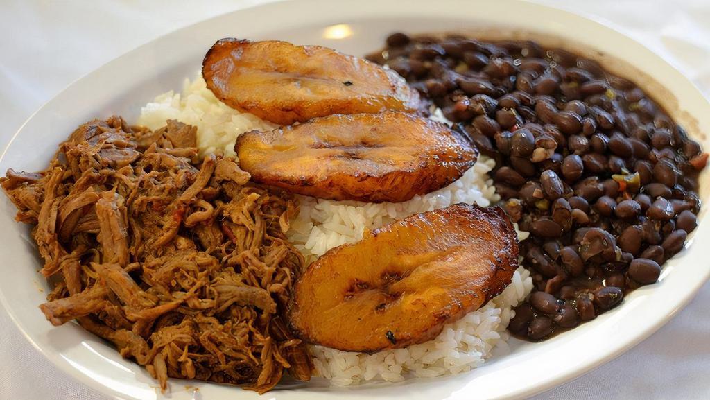 Pabellon Criollo · White Rice, black beans, sweet fried plantains and sheredded seasoned beef.
