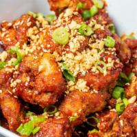 Korean Fried Chicken · Korean style Twice Fried Chicken wok tossed in our Spicy Korean Sauce, Garlic, Sesame Seeds,...