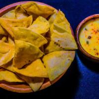 Chips & Dip · A bag of tortilla chips. Choose from our various signature dips.
