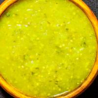 Salsa Verde · Blend of tomatillos, jalapenos, lime, yuzu juice, cilantro, and various spices. Housemade.