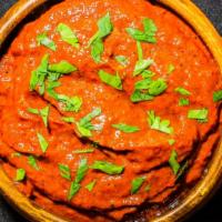 Salsa Roja · Blend of tomatoes, roasted red peppers, roasted onions, guajillo chile,  cilantro, and vario...