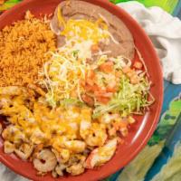 Puerta Vallarta Platter · Crab meat, shrimp, strips of chicken breast, and mushrooms sautéed in wine, topped with chee...