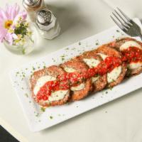 Breaded Eggplant · With fresh Mozzarella and our Sugo Sauce
