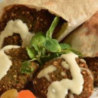 Falafel And Potatoes Sandwich · Falafel and potatoes served in a wrap with jerusalem salad and tahini sauce.