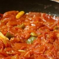 Mediterranean Kalaya · Cooked tomatoes with onions, green peppers, black olives, and spices in olive oil topped wit...